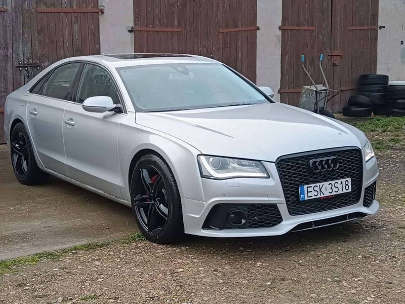 Передній бампер на Audi A8 2010-2014 стиль RS V1 429815 фото