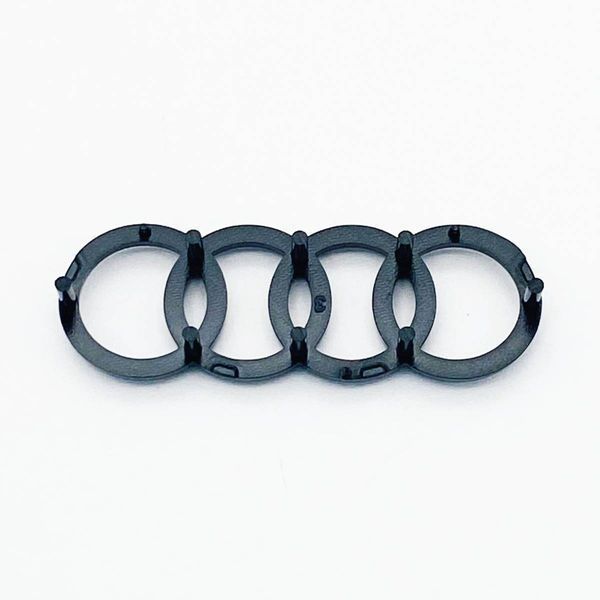 Эмблема логотип шильдик на руль Audi 2012- 12 клипс черный глянец 423919 фото