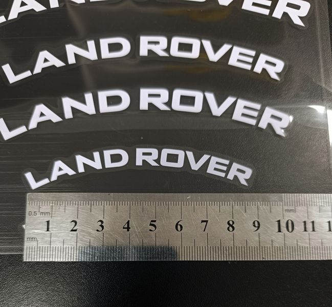 Наклейки на супорт Land Rover білі вигнуті 521631 фото